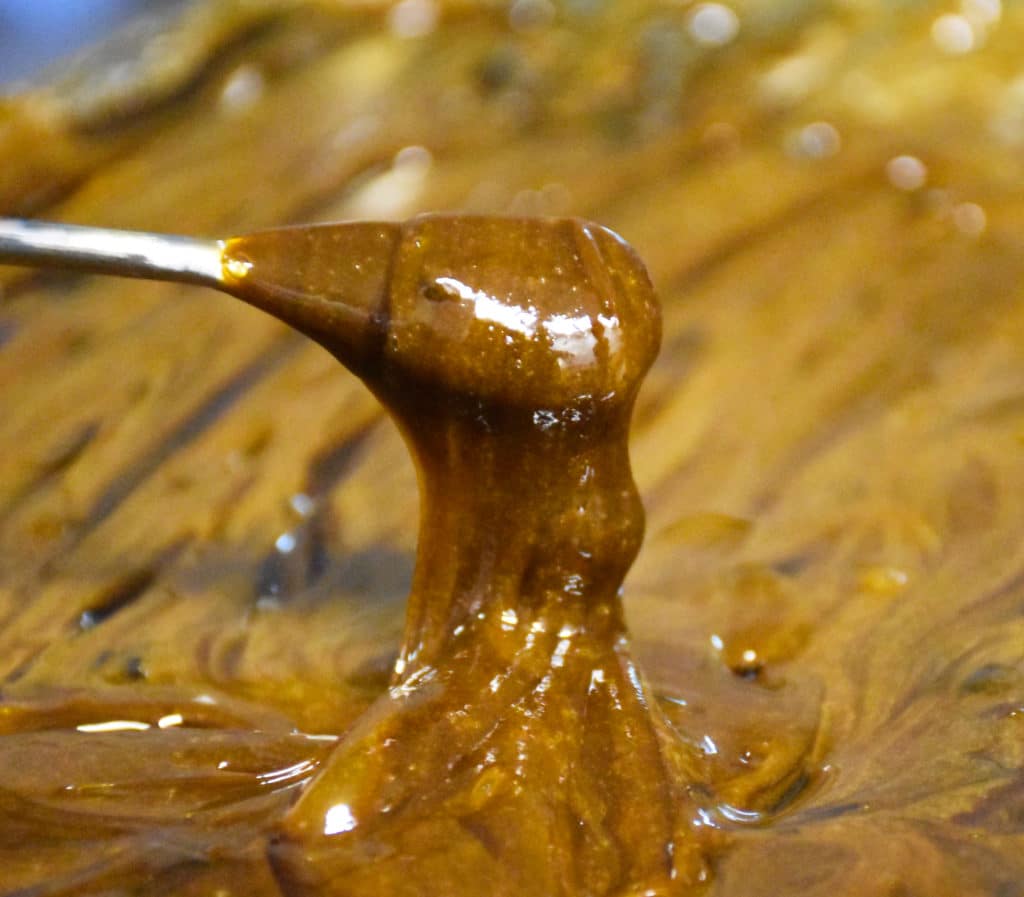 Close-up Full Spectrum oleoresin extracted from hemp bloom for Genesis Blend CBD Oil.