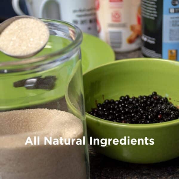Fresh elderberries and raw cane sugar, natural ingredients used to craft delicious and potentially beneficial CBD gummies.